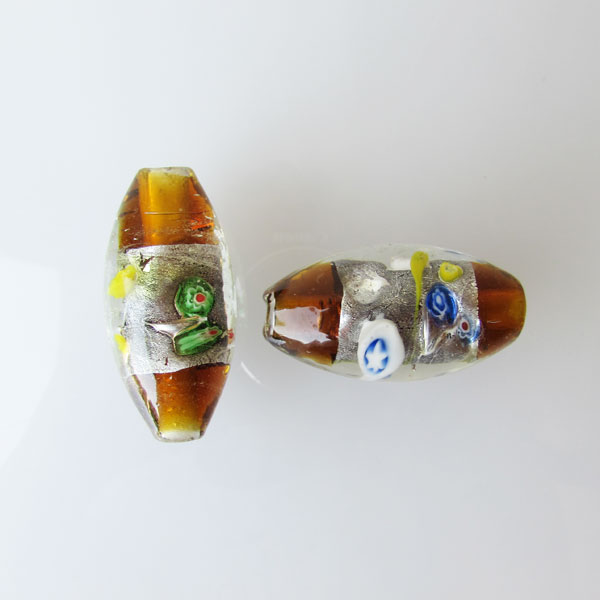 Grote glaskraal met groot gat, 45 x 22 mm, dark topaz./ silverfoil met millefiori, per stuk