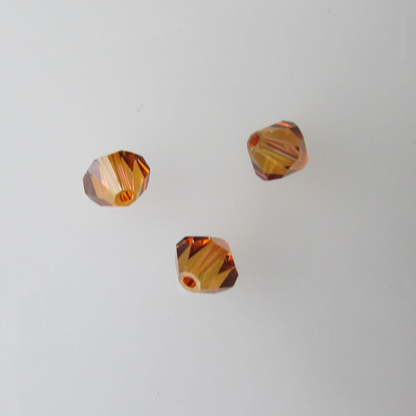 Swarovski® bicone, Xilion, 6 mm, TOPAZ, verpakt p. 6 stuks