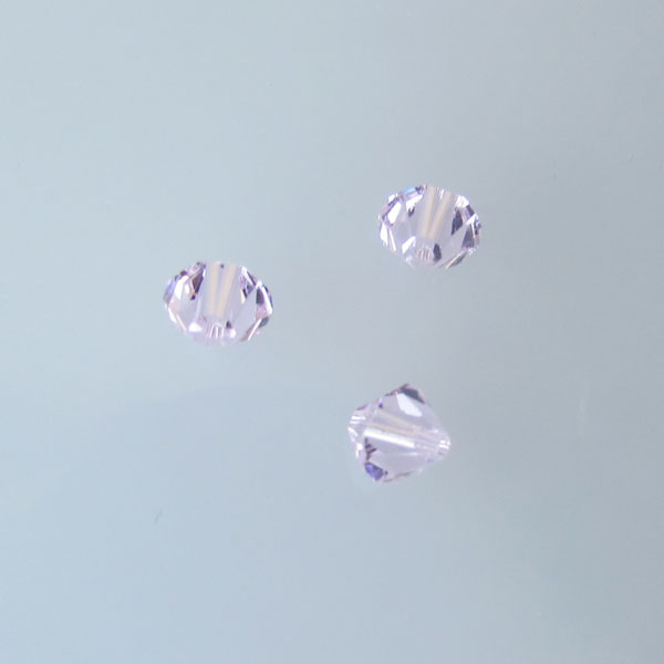 Swarovski® bicone, Xilion, 6 mm, LIGHT ROSE, verpakt p. 6 stuks